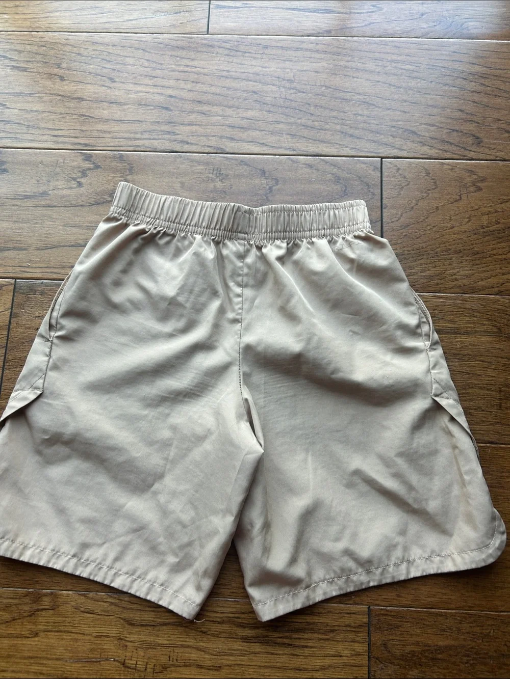 Nike Beige Athletic Shorts with White Swoosh